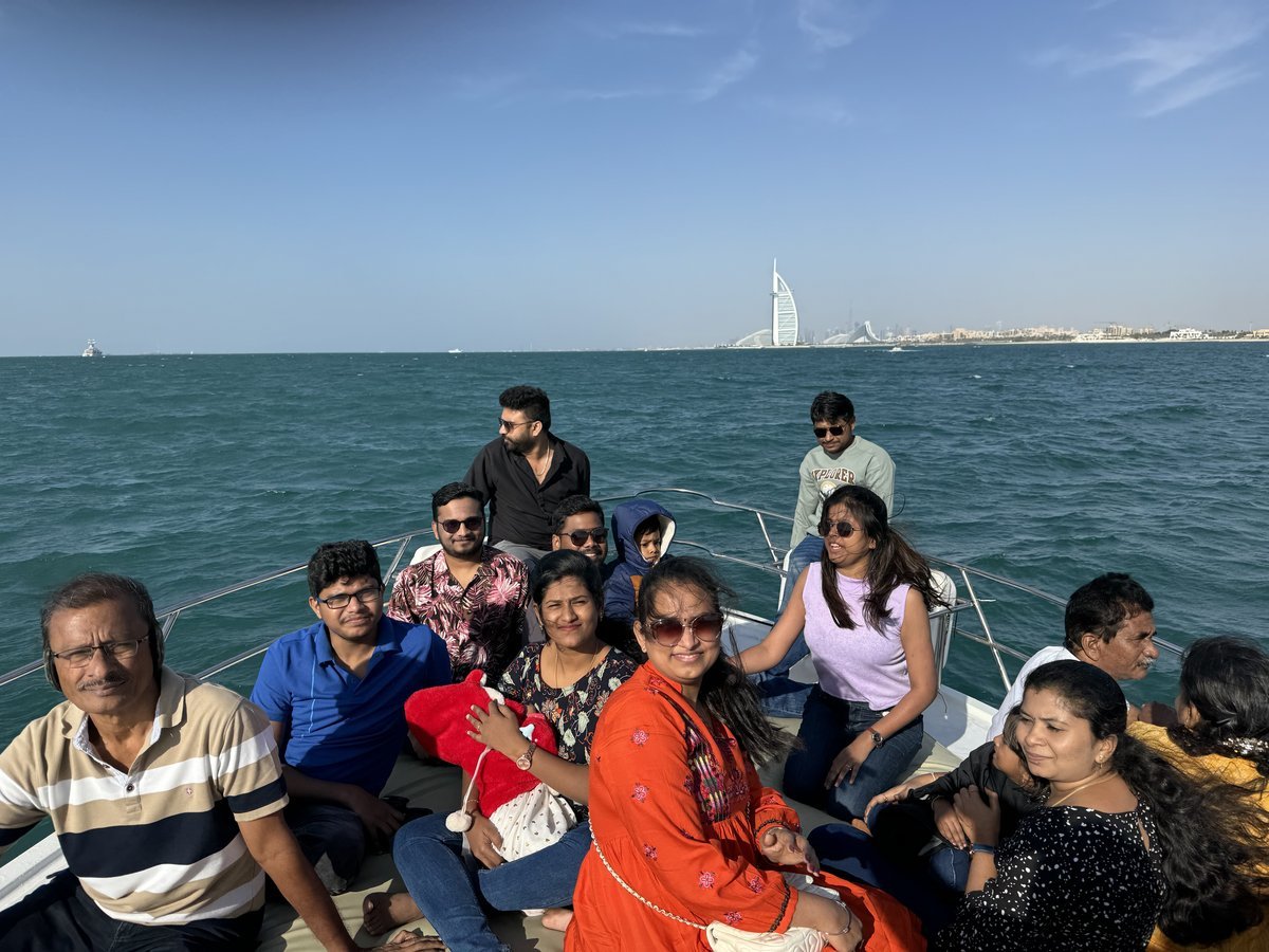 Friends celebrating at night with Dubai Marina skyline